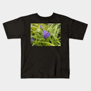 Blue and yellow flower in leaves Kids T-Shirt